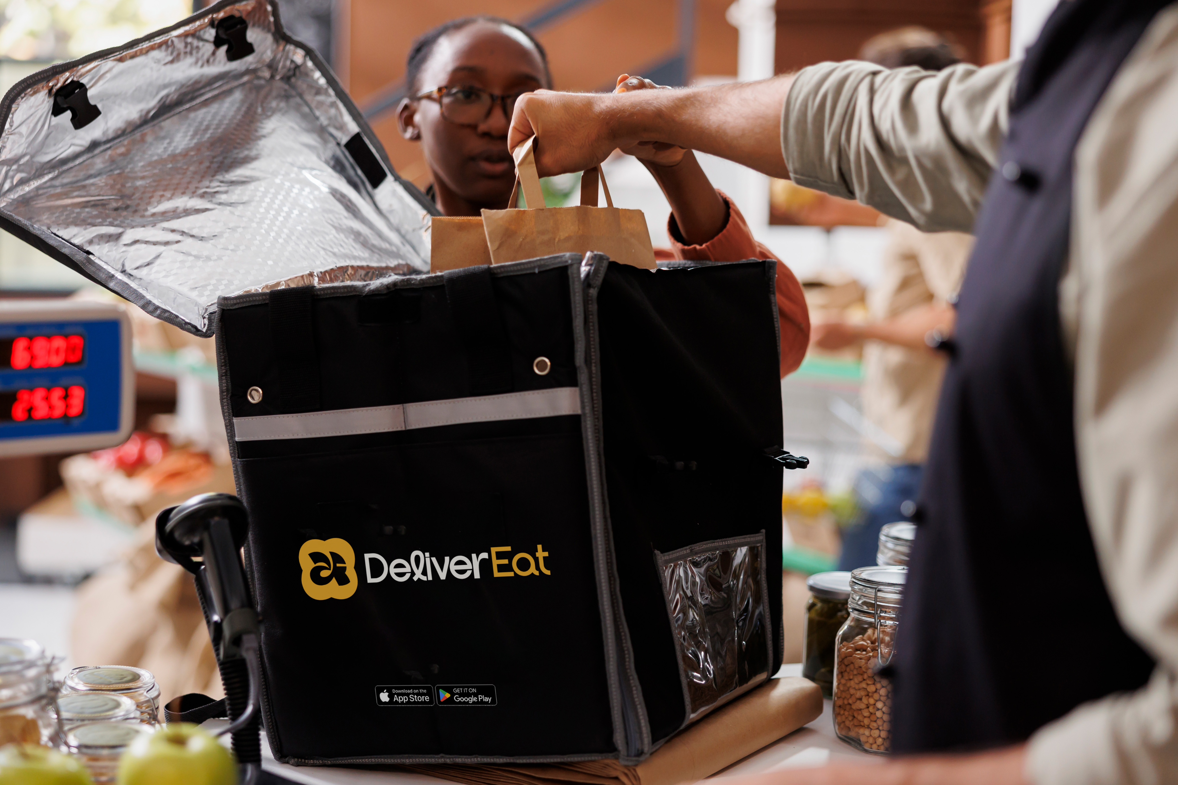 Rider using a DeliverEat thermal delivery bag